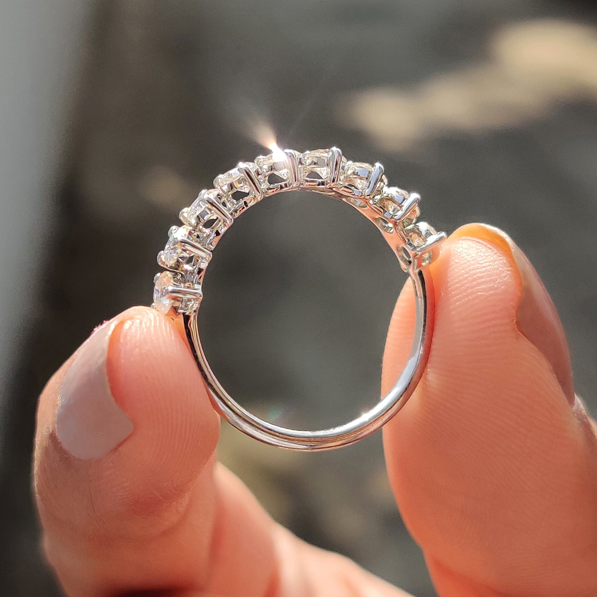 Moissanite half eternity band featuring brilliant round stones for a refined and modern style.