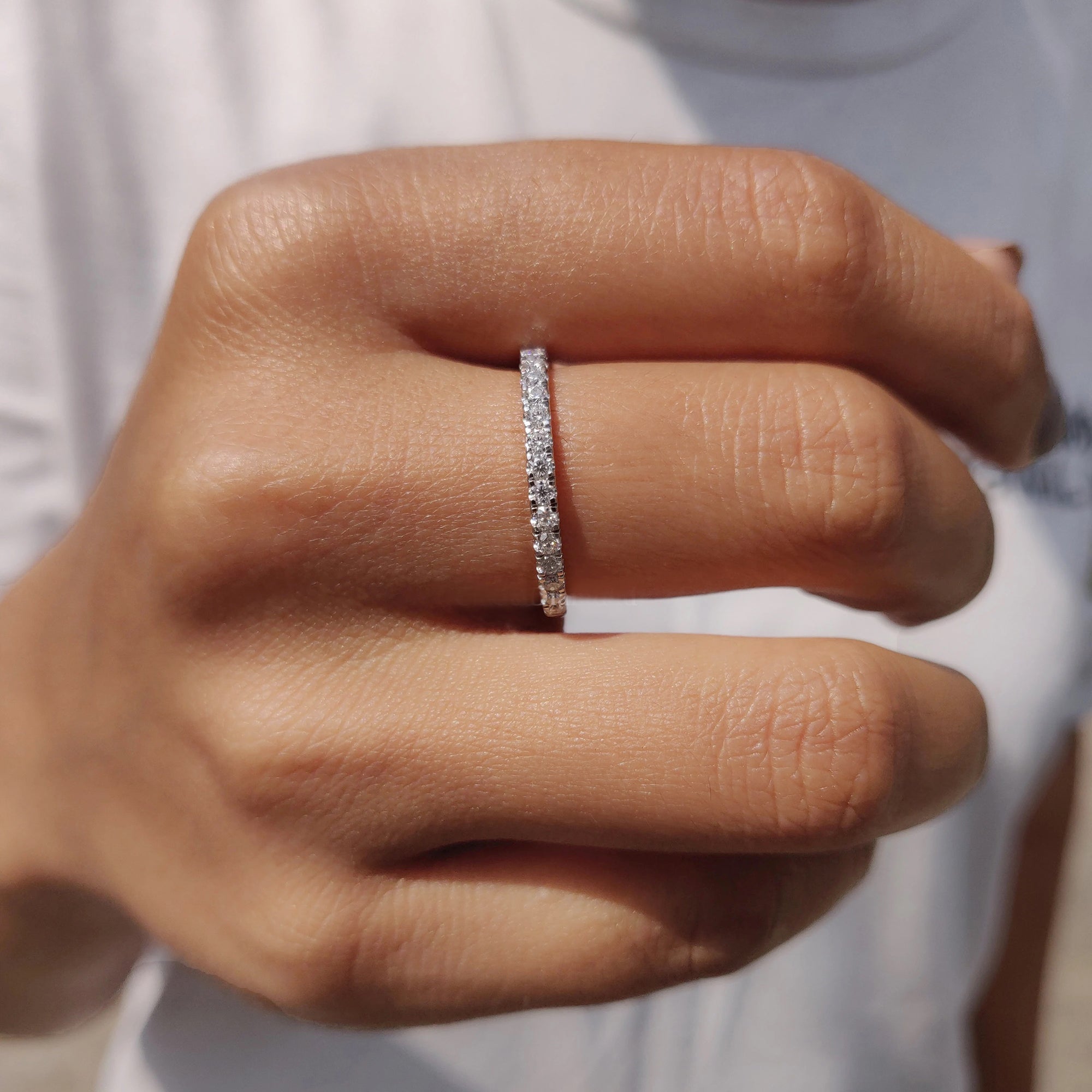 Half eternity wedding band matches white gold moissanite wedding band.
