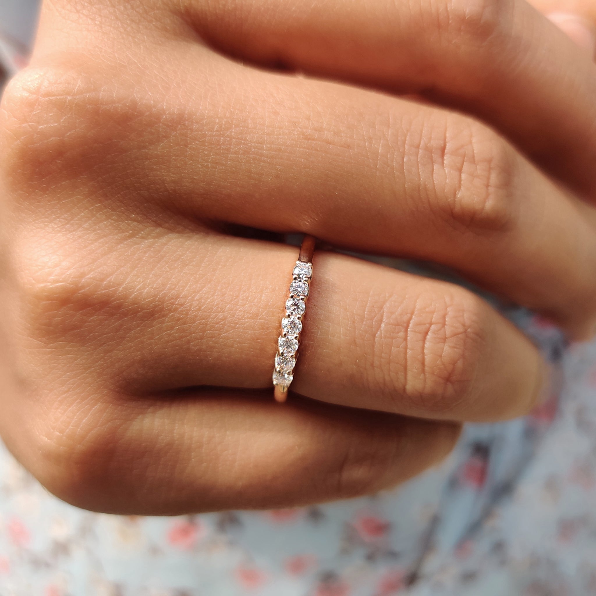 Handmade band featuring round moissanite stones set in a beautiful rose gold setting.