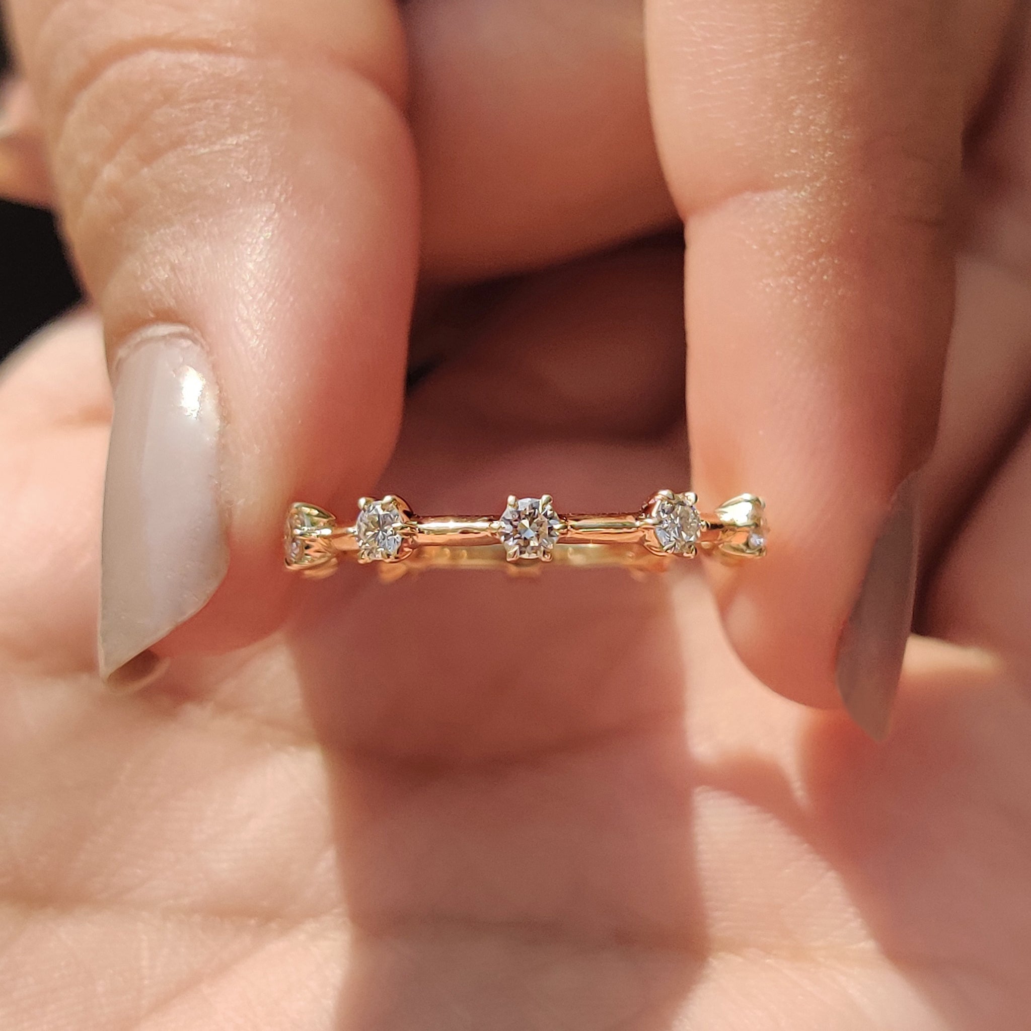 Handmade Jewelry featuring a diamond wedding band.

