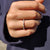 Full eternity wedding band circles the finger completely.
