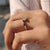 Solitaire setting ring featuring a single diamond.

