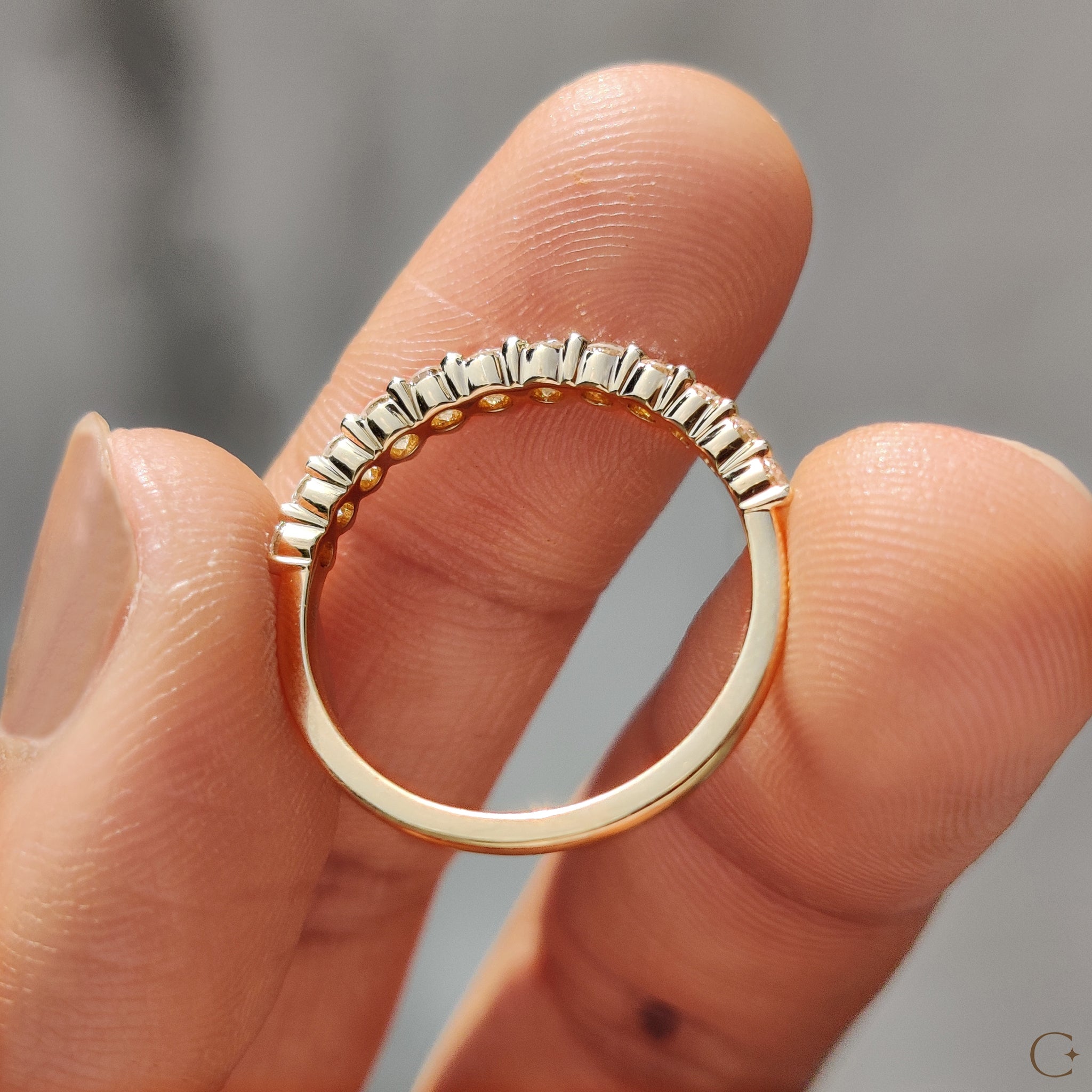 Delicate prong set band with round lab diamonds.
