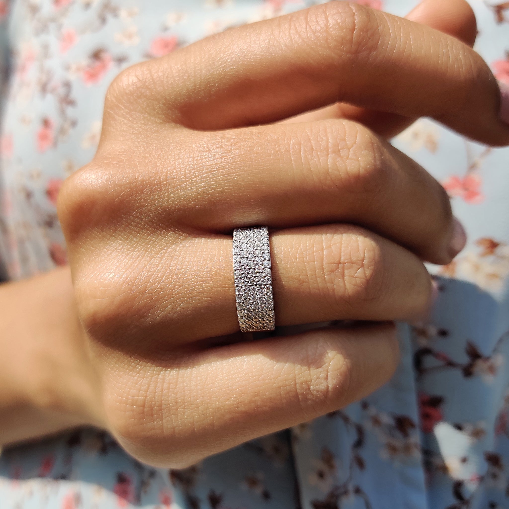 Multi row pave set band featuring rows of moissanite for maximum shine and elegance.