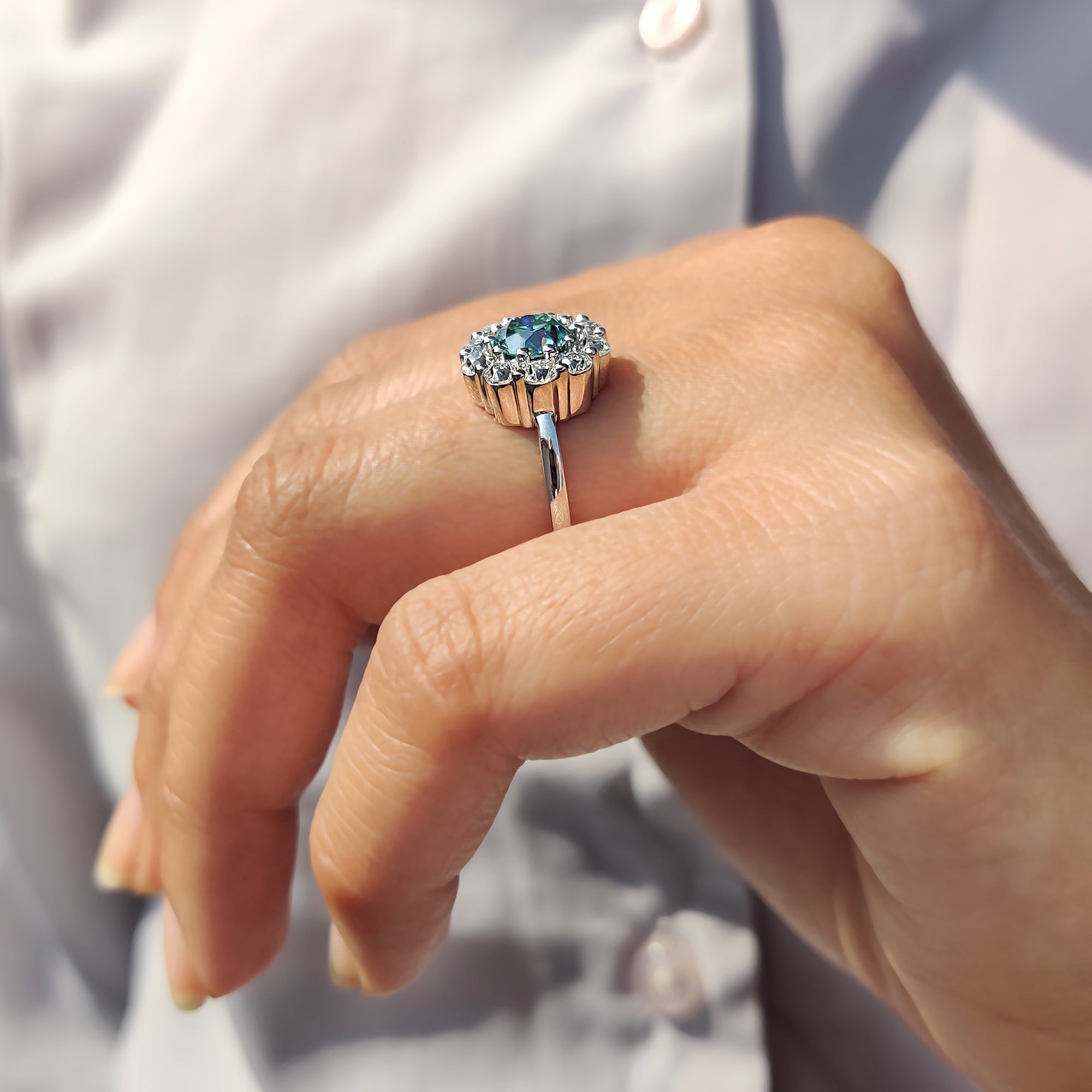 Round moissanite ring shines with joyful endless light.