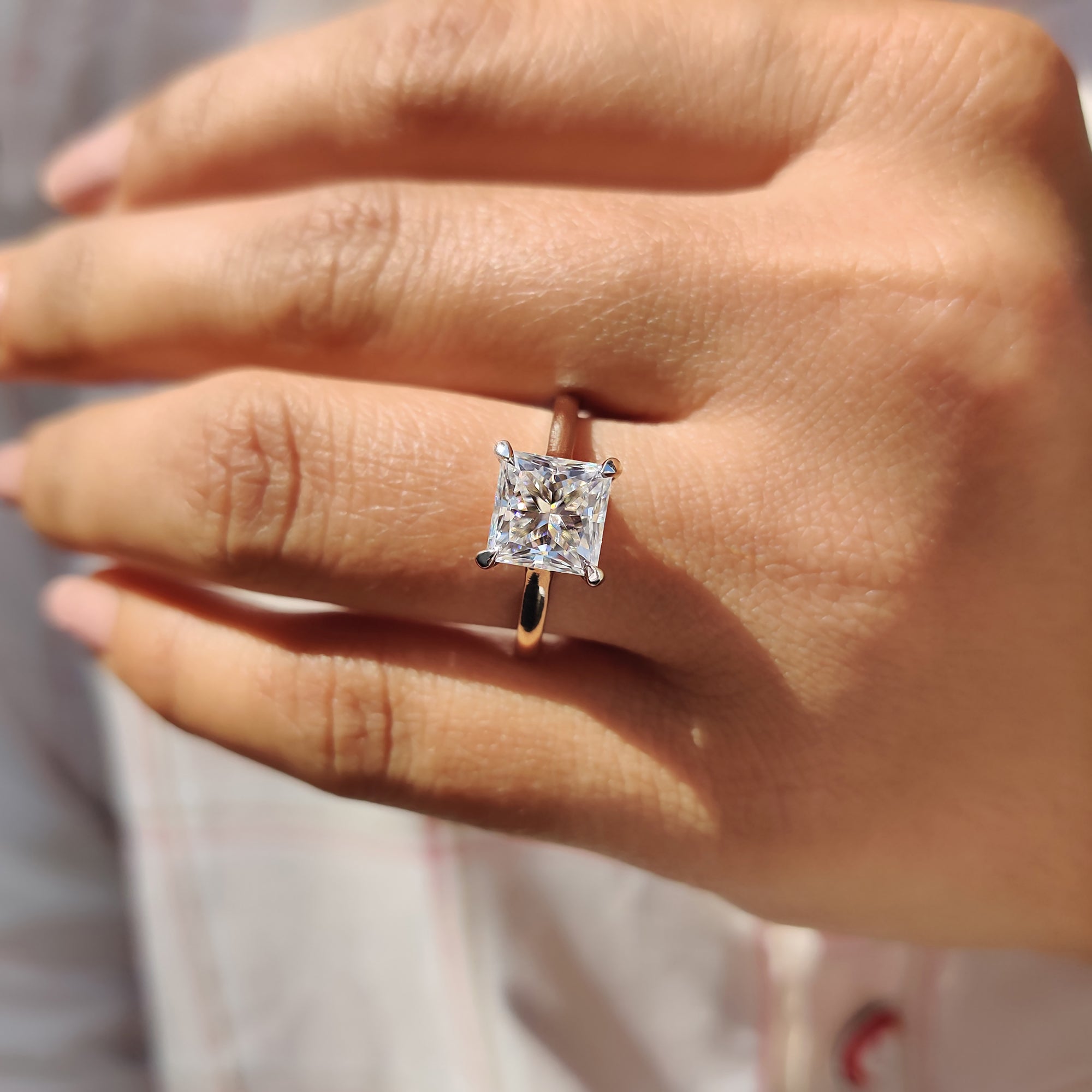 Moissanite engagement ring with solitaire setting, ideal for a stunning and simple proposal ring.


