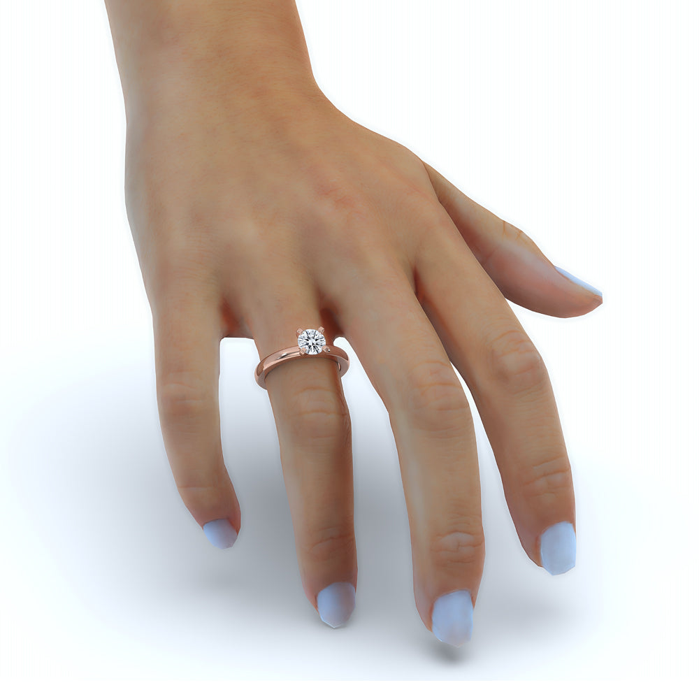 Round gold diamond ring in a prong setting, showcasing a lab grown diamond solitaire.