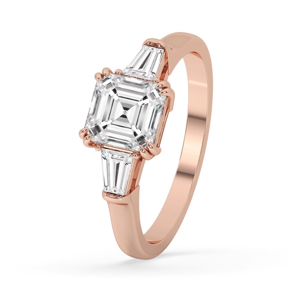 1 carat asscher cut diamond ring in rose gold with cathedral ring setting and diamond baguette details for timeless elegance.

