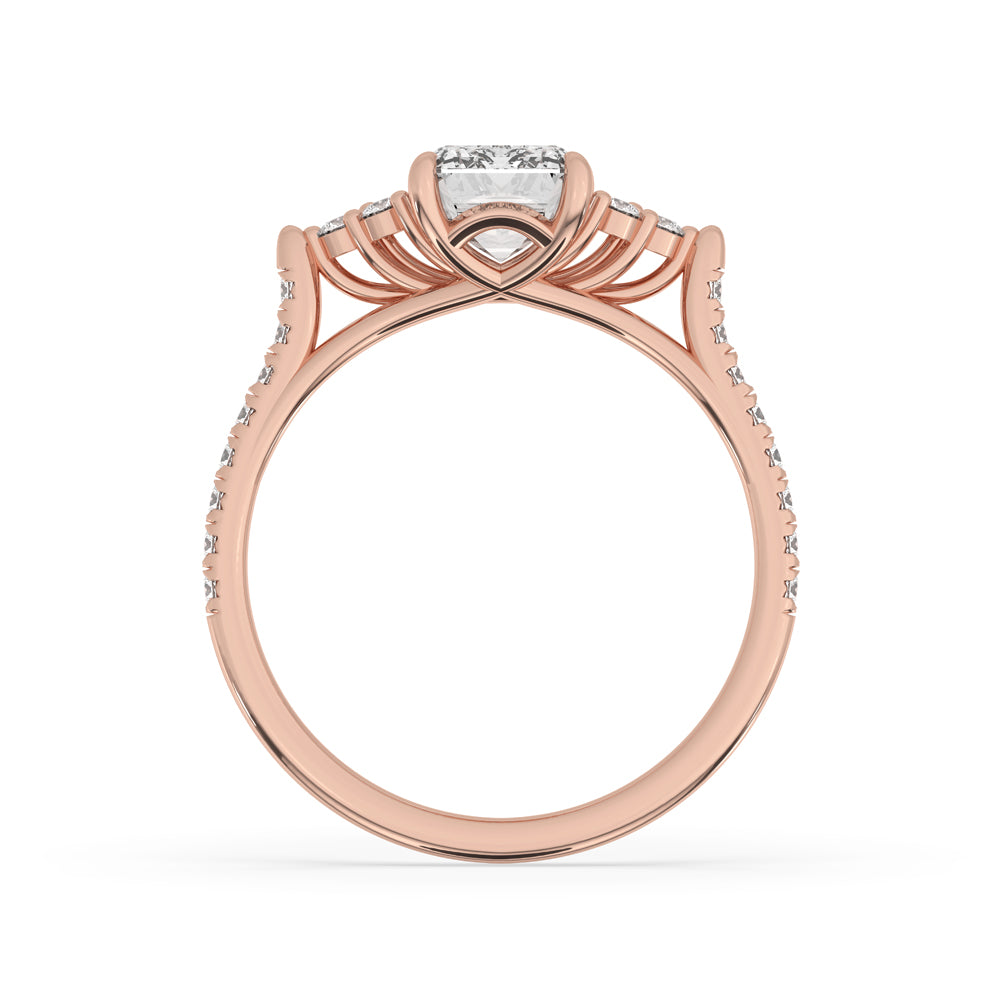 Cathedral setting ring with emerald cut diamond and claw prongs.
