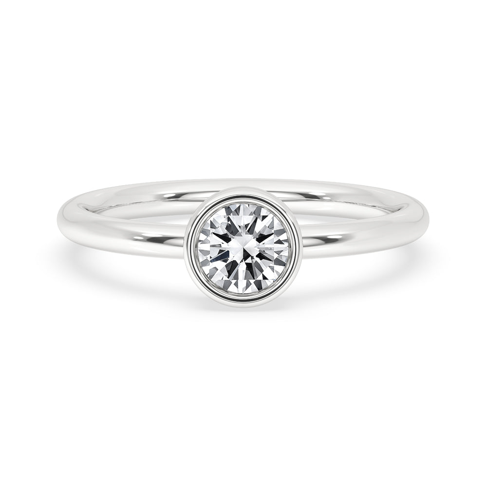 Stunning gold solitaire engagement ring with a round brilliant cut diamond ring, perfect for timeless elegance.

