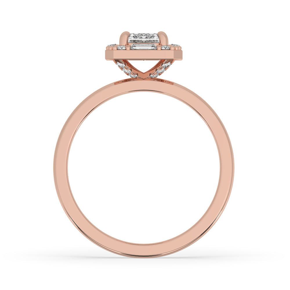 Halo diamond engagement ring with a 2 carat emerald cut center stone and round diamond accents.
