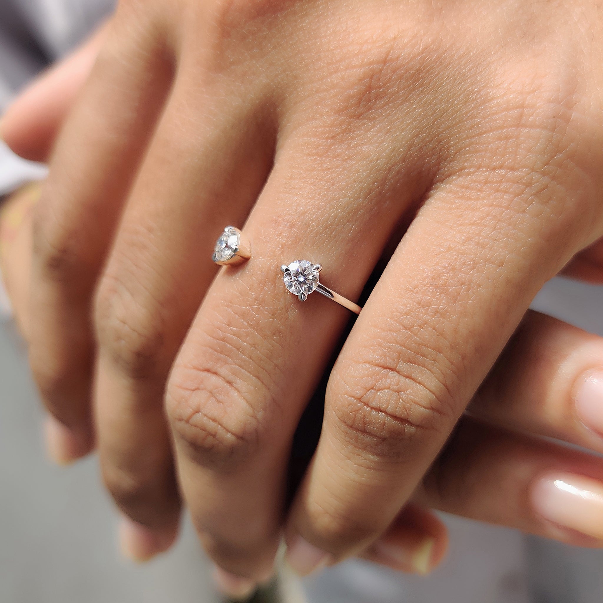 Prong set band designed with an open gap and accents for a minimalist look.

