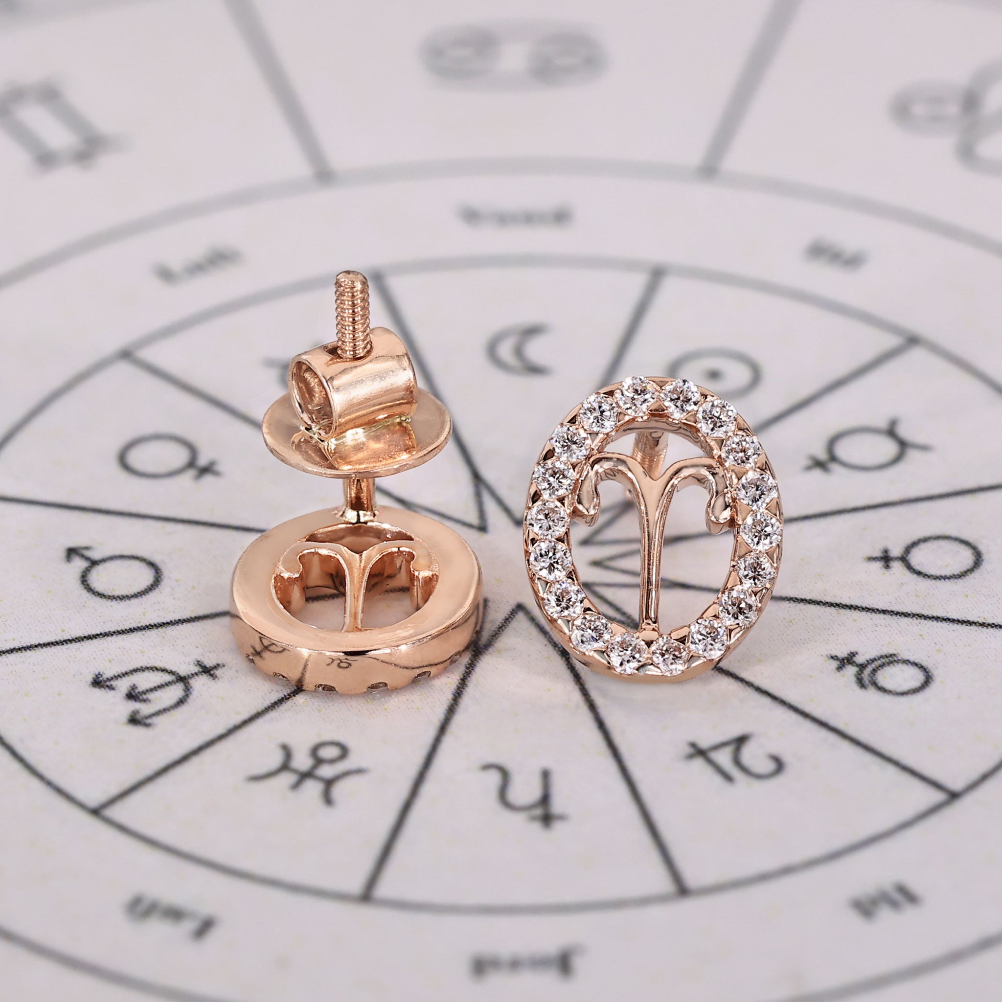 Aries stud earrings handcrafted with halo diamond settings.
