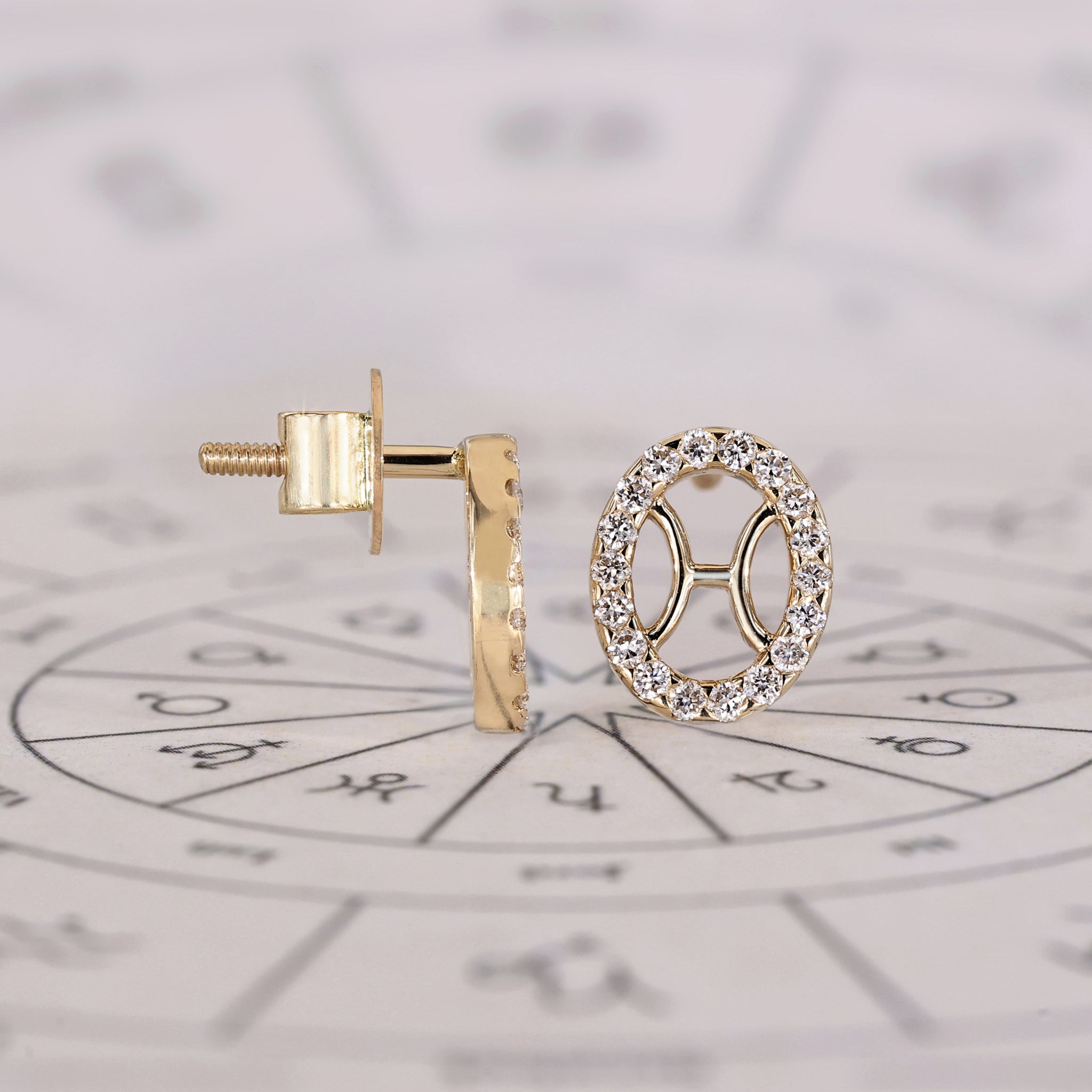 Pisces stud earrings handcrafted with round halo diamonds.
