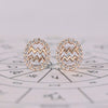 Aquarius earrings in rose gold with round diamond halo studs.
