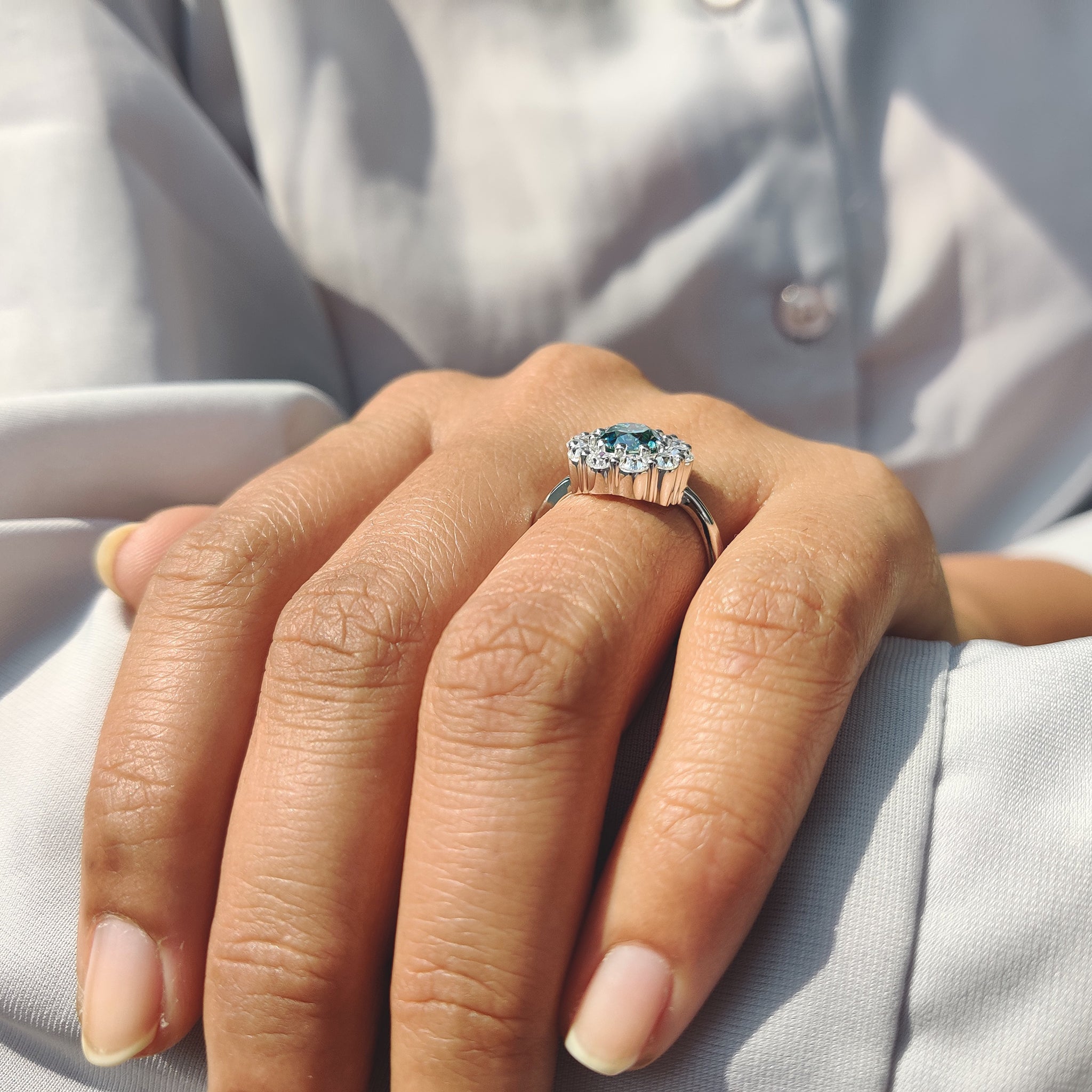 Aqua blue engagement ring carries fresh ocean glow.