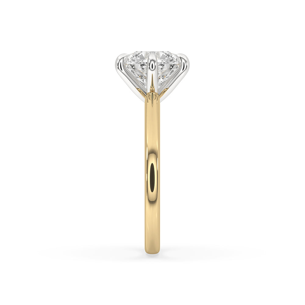 Handmade jewelry with a round diamond solitaire engagement ring from Carat Diamonds.