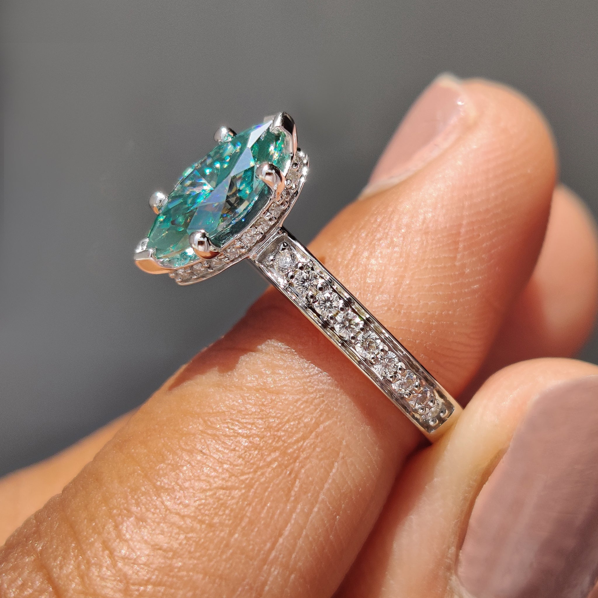 V and round prong setting showcasing the beauty of the marquise moissanite stone.