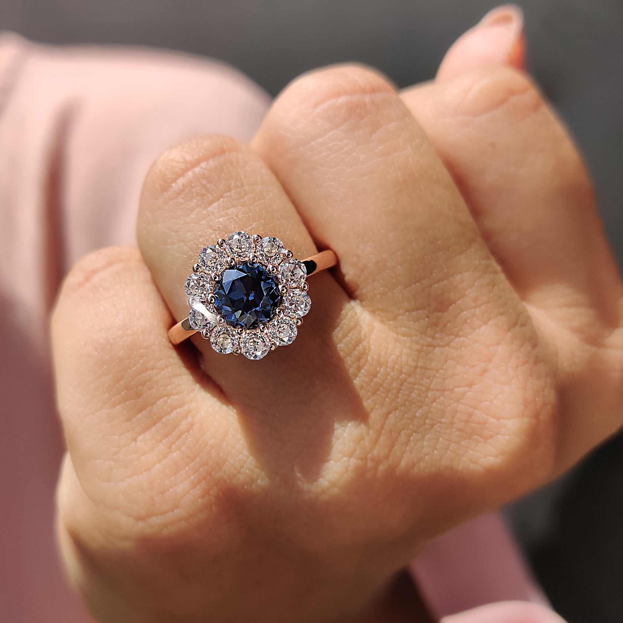 Prong setting ring with a blue round old European cut stone for a classic and luxurious look.
