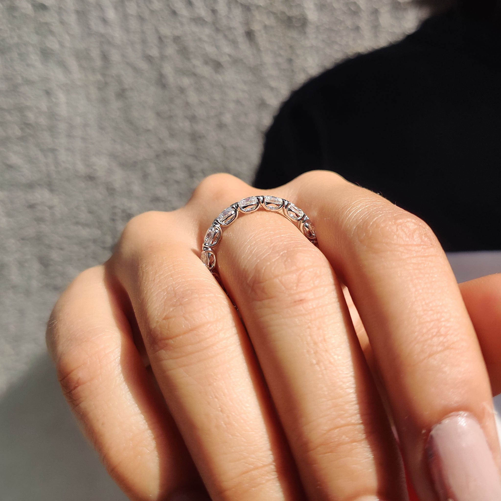 Oval cut moissanite wedding band crafted for sleek elegance and lasting shine.