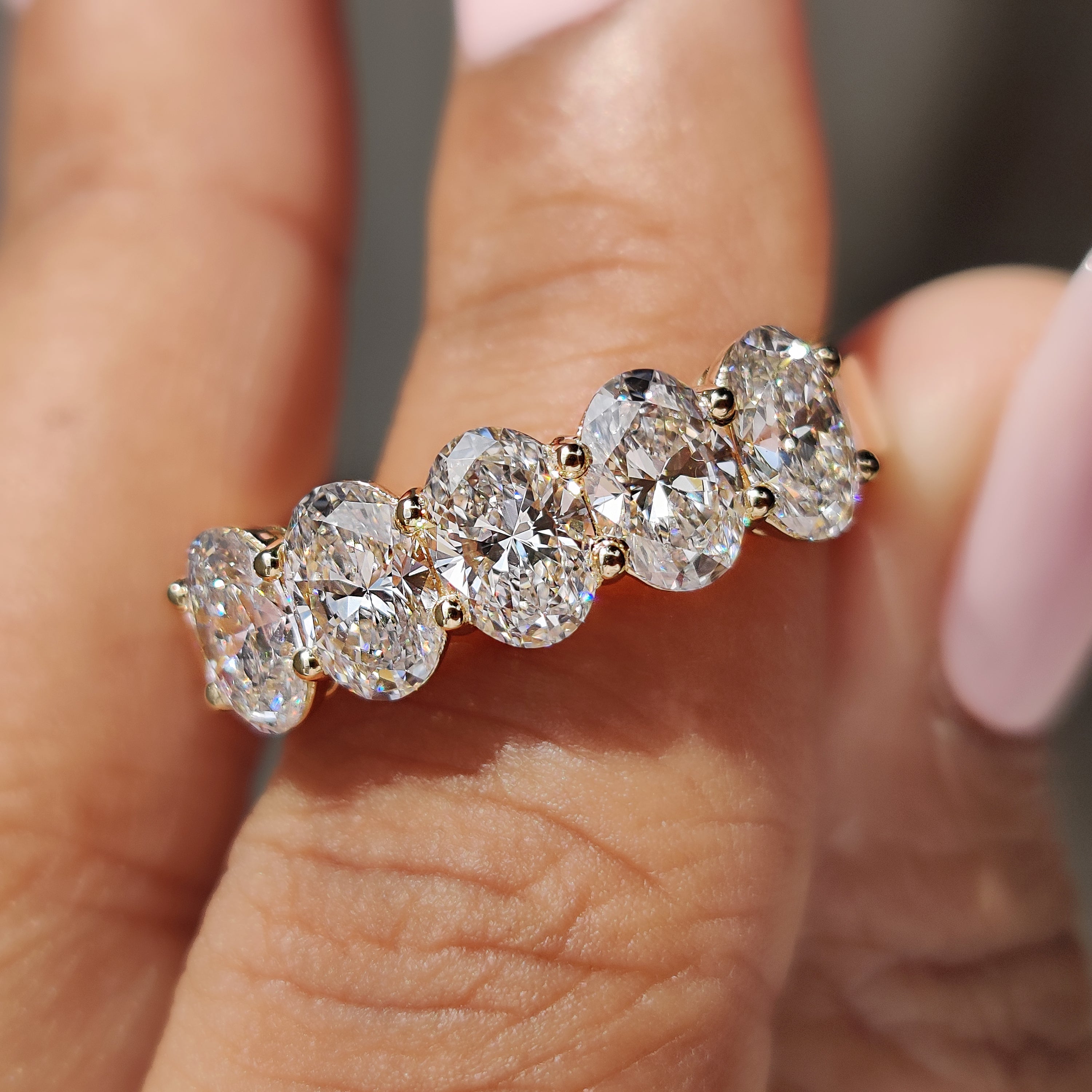 Oval diamond wedding band with a classic design.
