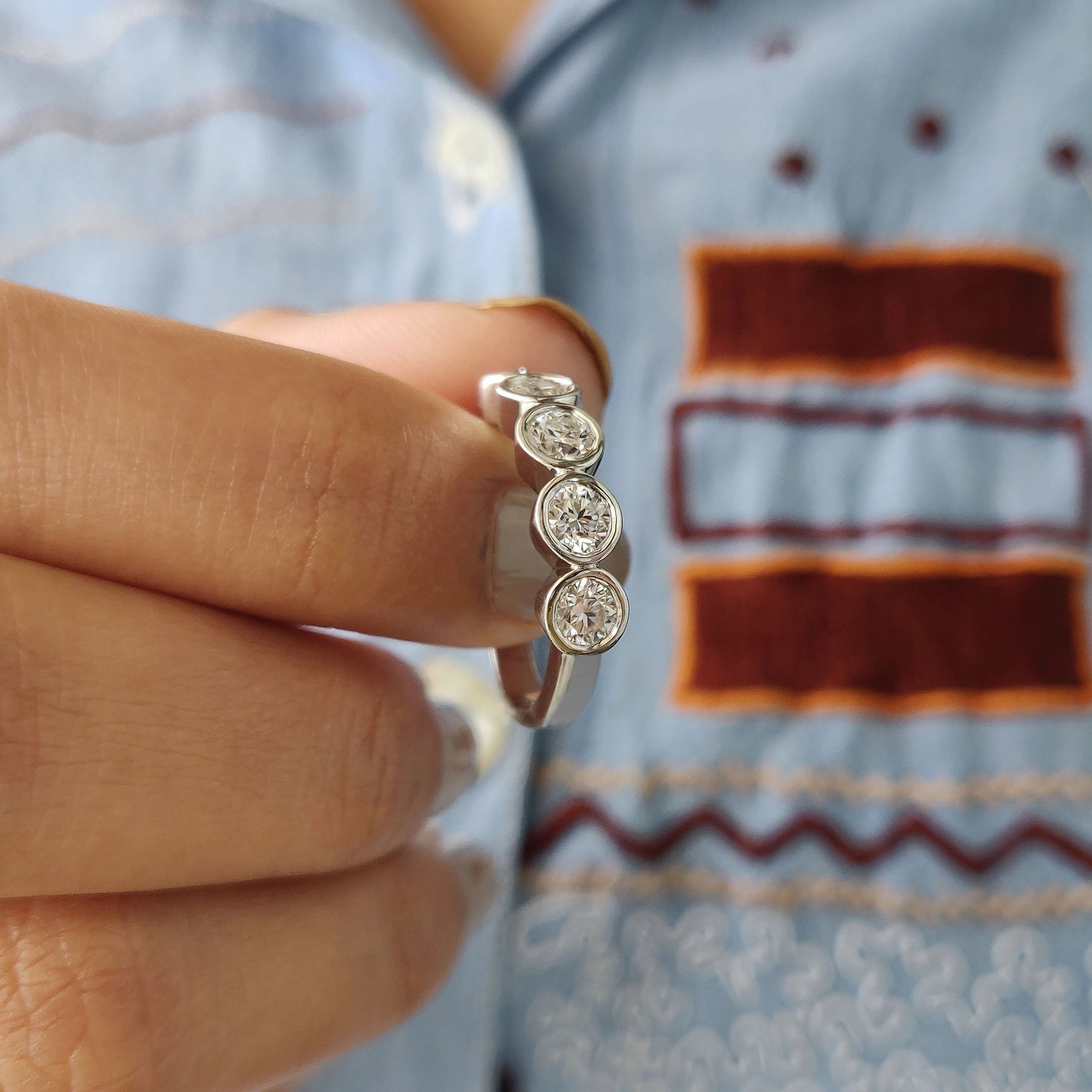 Round cut moissanite wedding band design.
