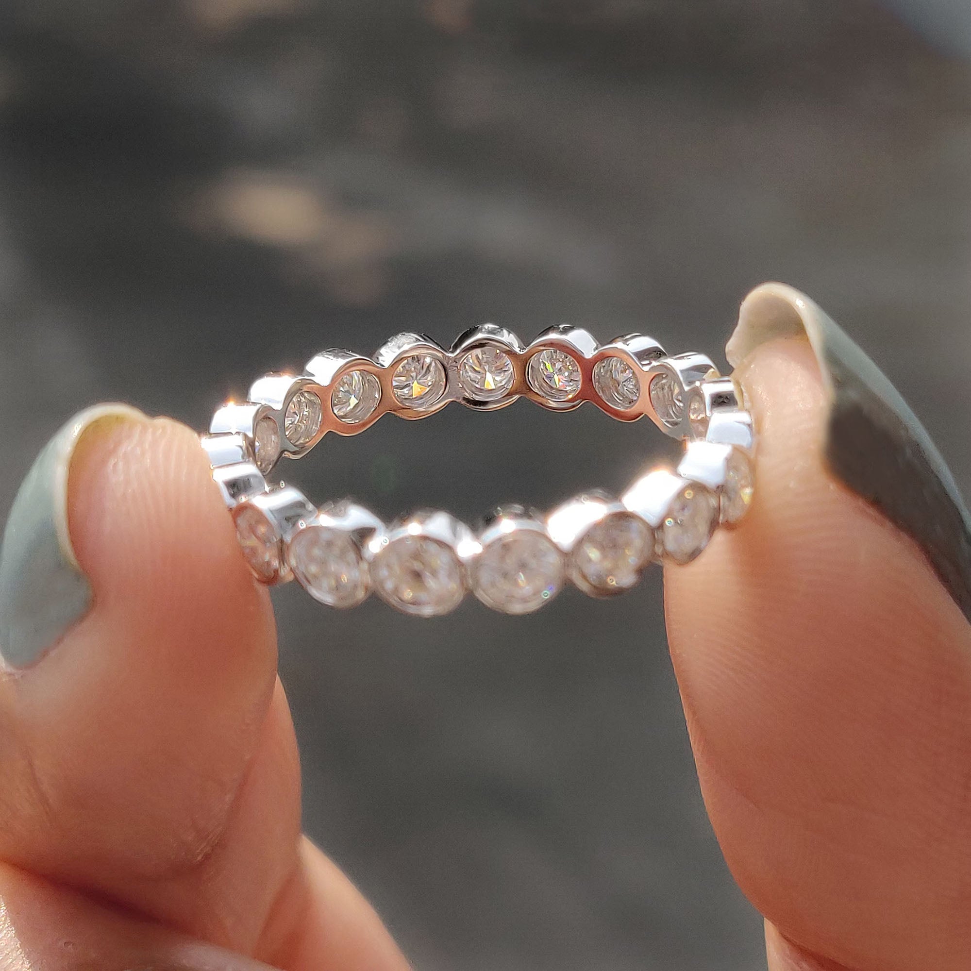 Moissanite eternity band with brilliant sparkle.
