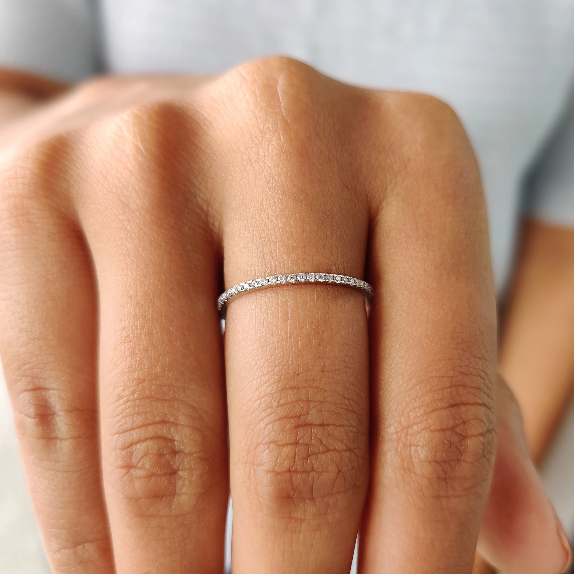 Moissanite wedding band with a classic shape and minimalist appeal.
