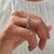 Round cut wedding band styled for smooth brilliance.