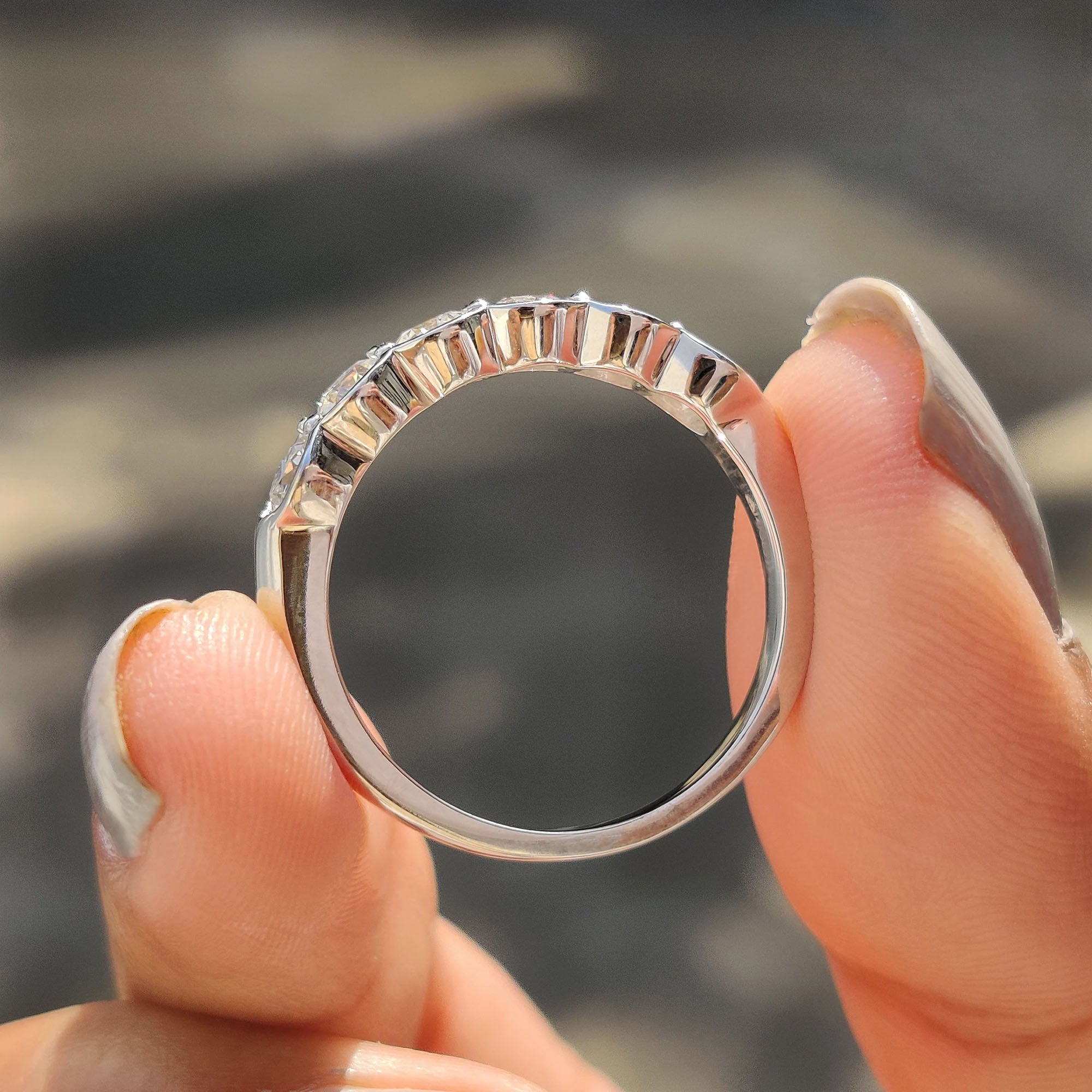 Moissanite wedding band offering a radiant, affordable alternative to diamonds.
