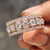 Moissanite half eternity band featuring round stones set halfway for daily comfort and subtle brilliance.
