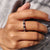 Black Moissanite is styled with bold sparkle and shine.
