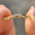 Yellow gold curved wedding band meets dainty curved wedding band.