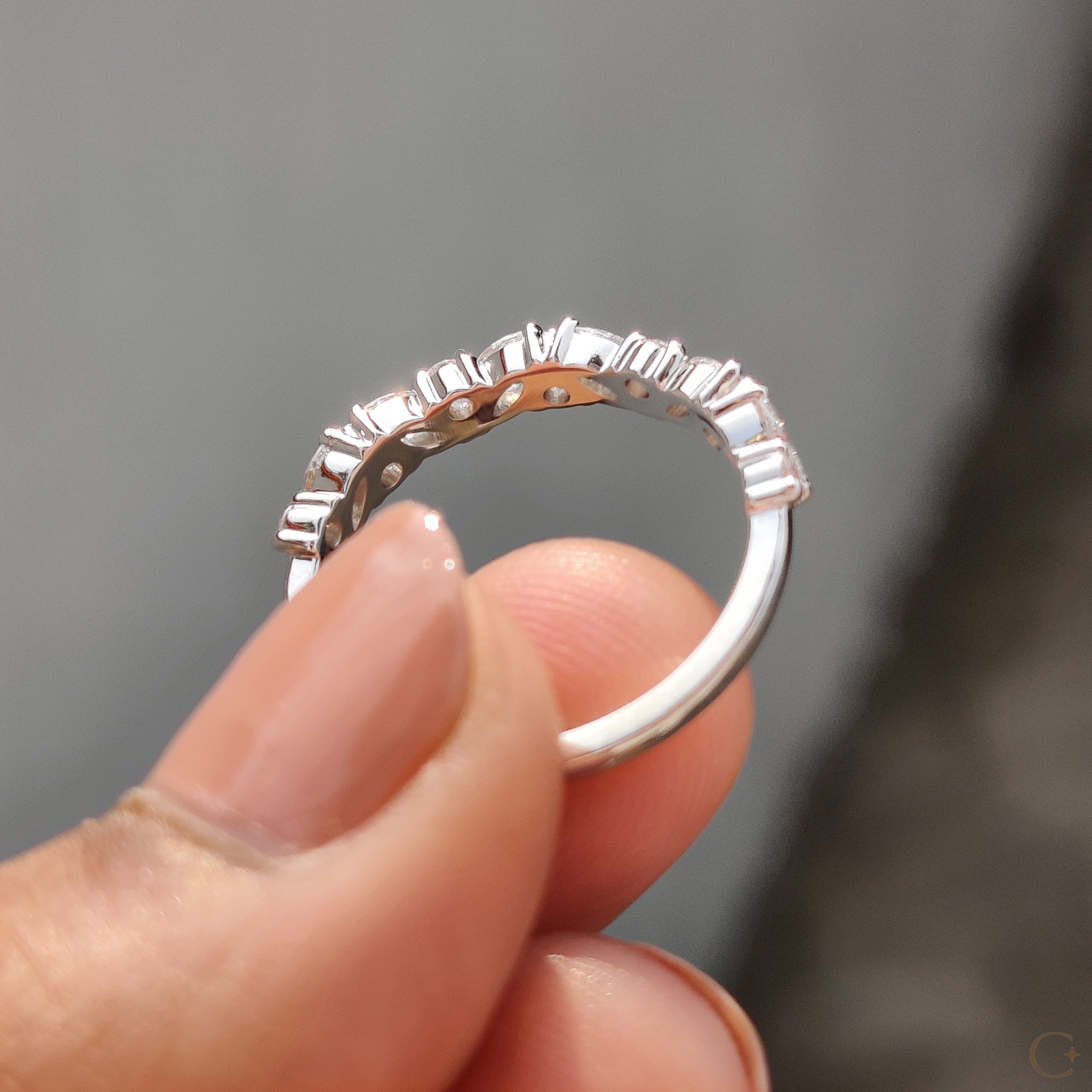 Elegant prong set wedding band in lab-grown diamonds.
