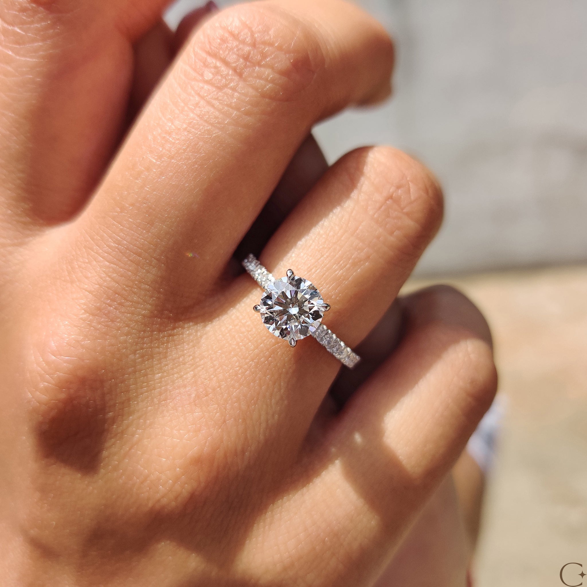 White gold engagement ring featuring a beautiful round cut.