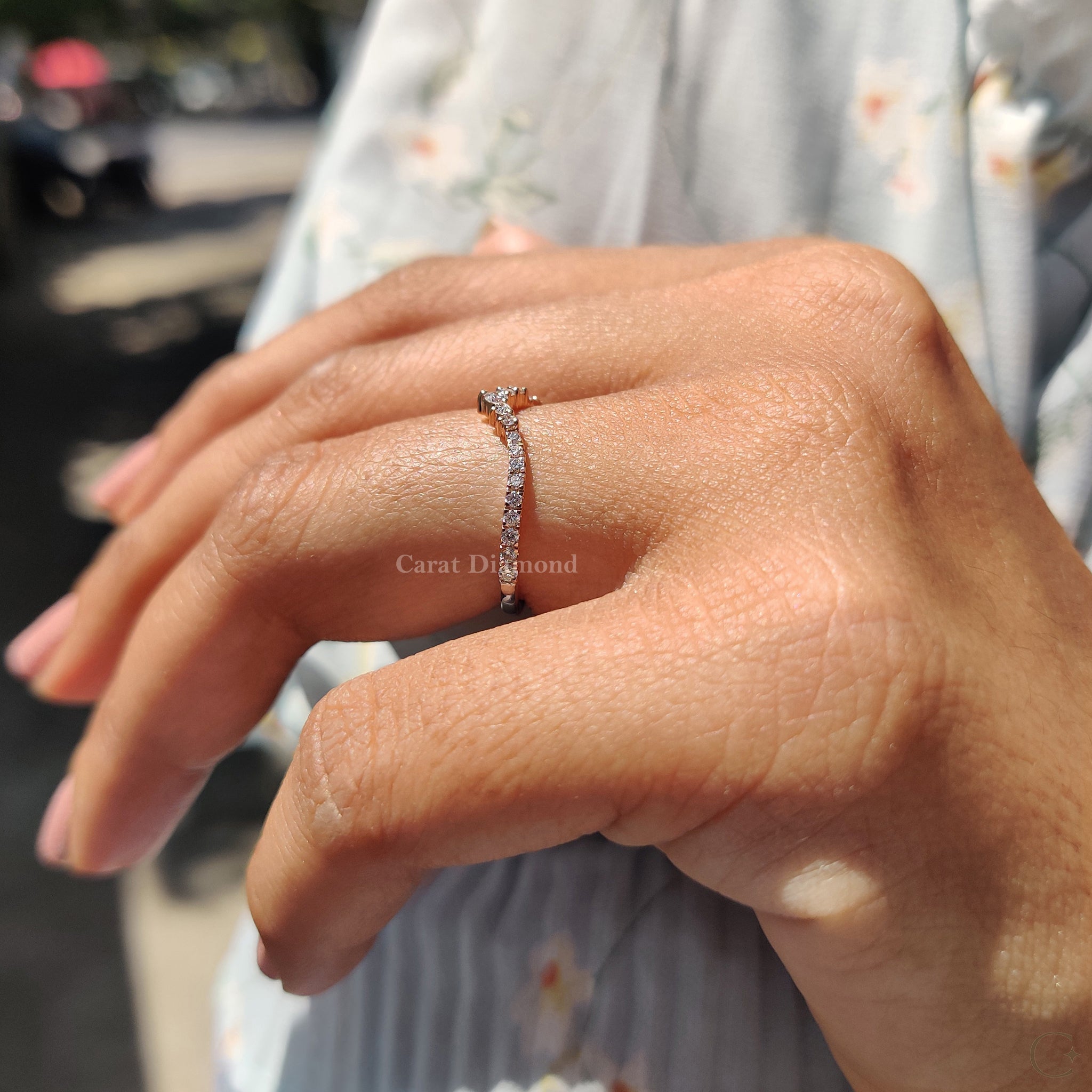 Buy wedding band shown inside an open ring box.
