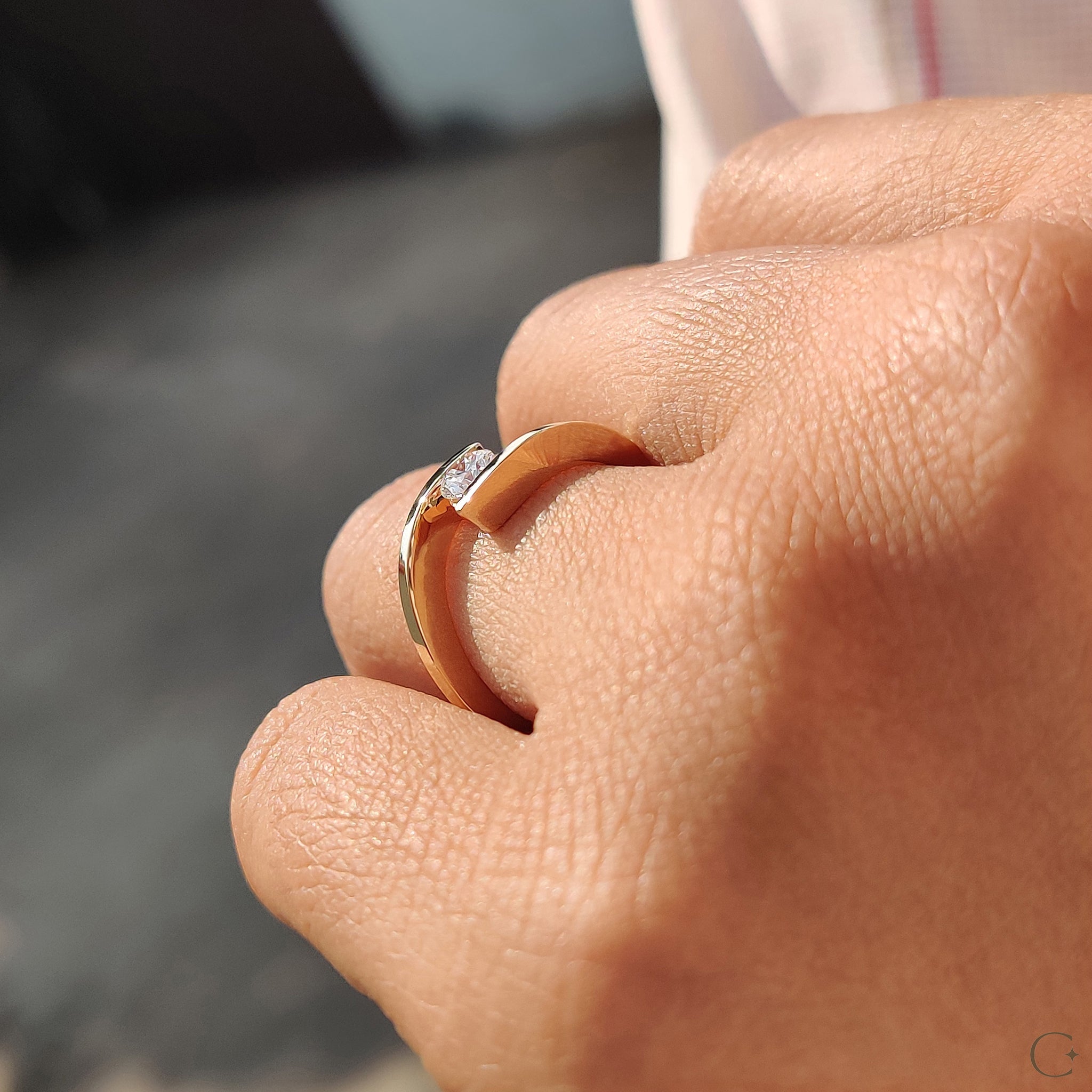 Tension setting ring holding the diamond securely.

