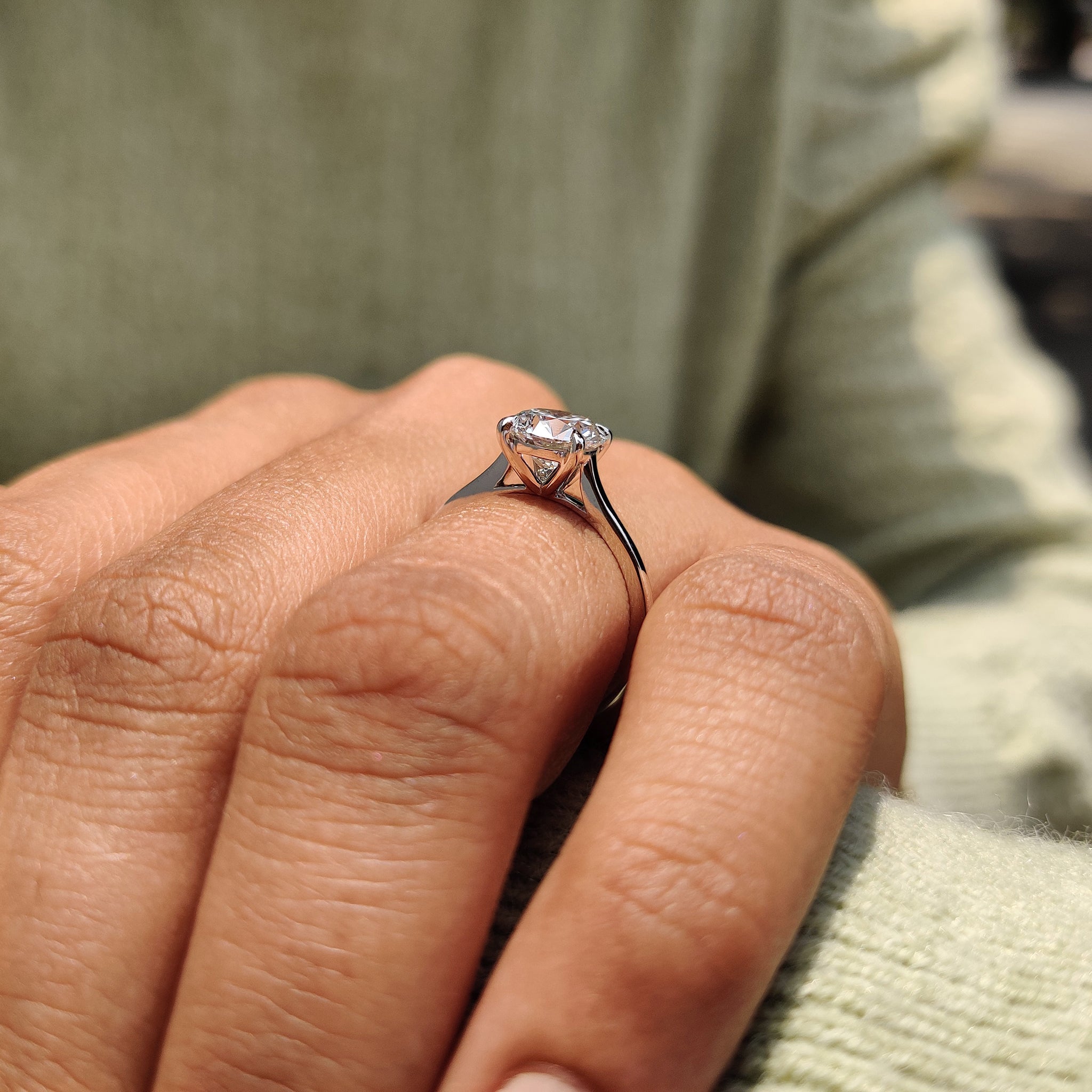 Solitaire setting ring showcasing a sparkling round diamond.
