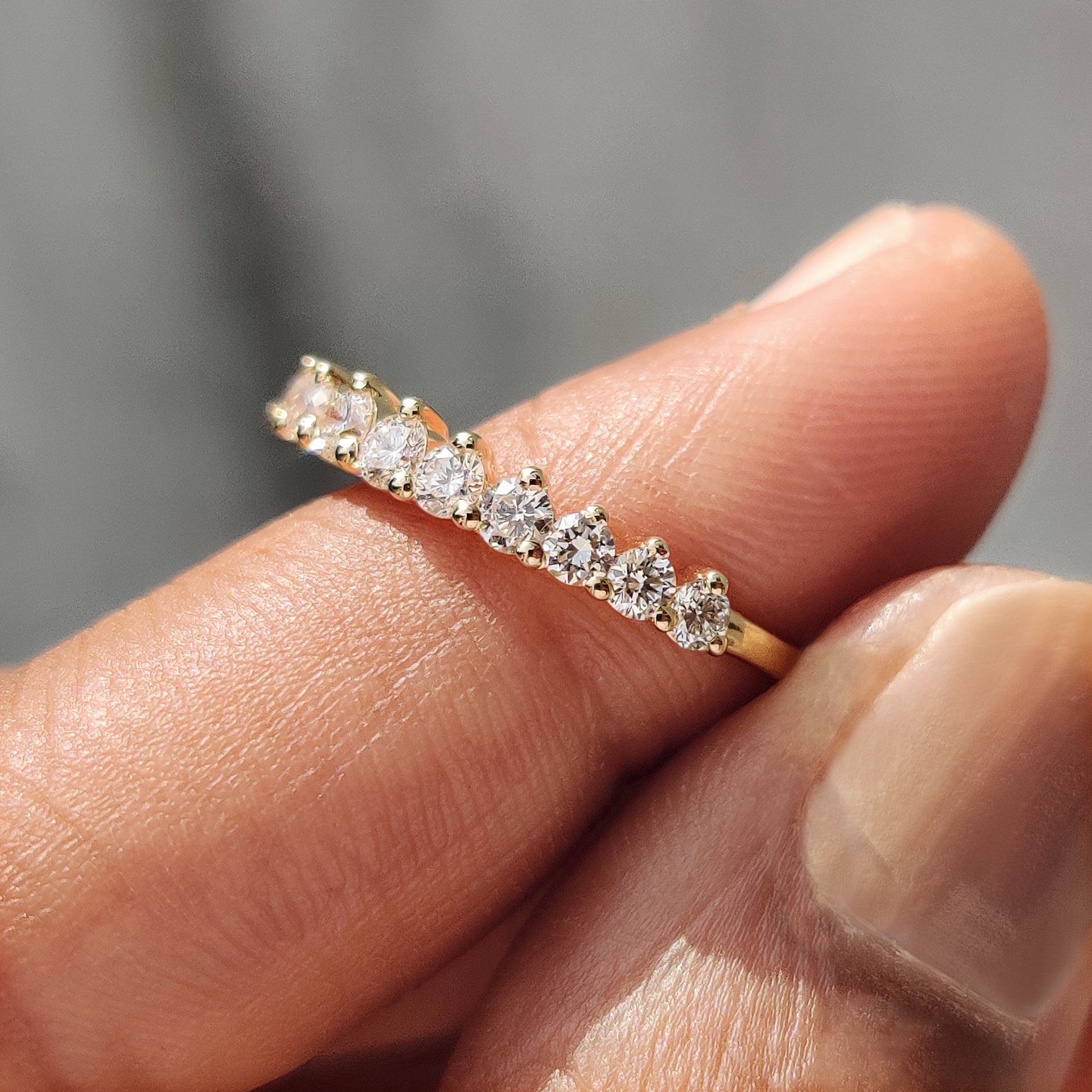 Prong set wedding band showcasing secure diamond brilliance.
