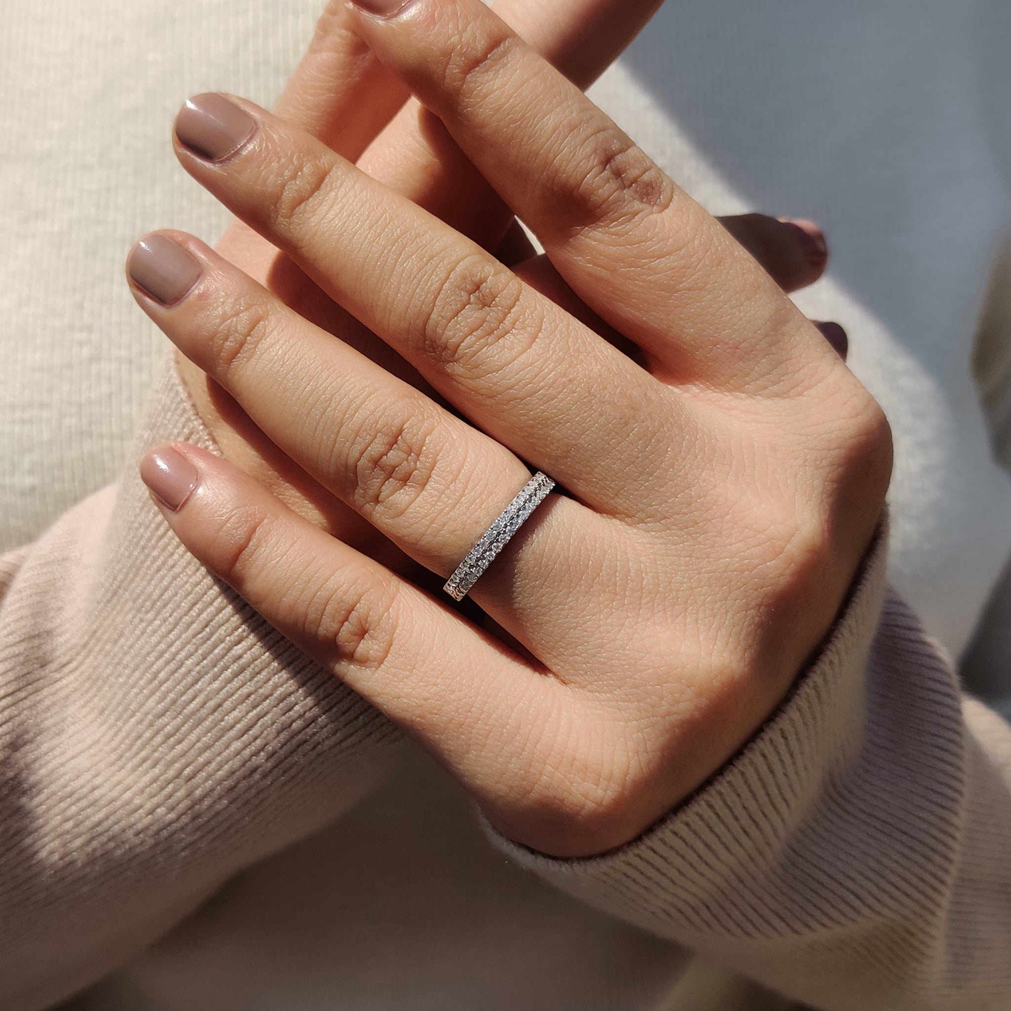 Round cut wedding band in white gold for women.