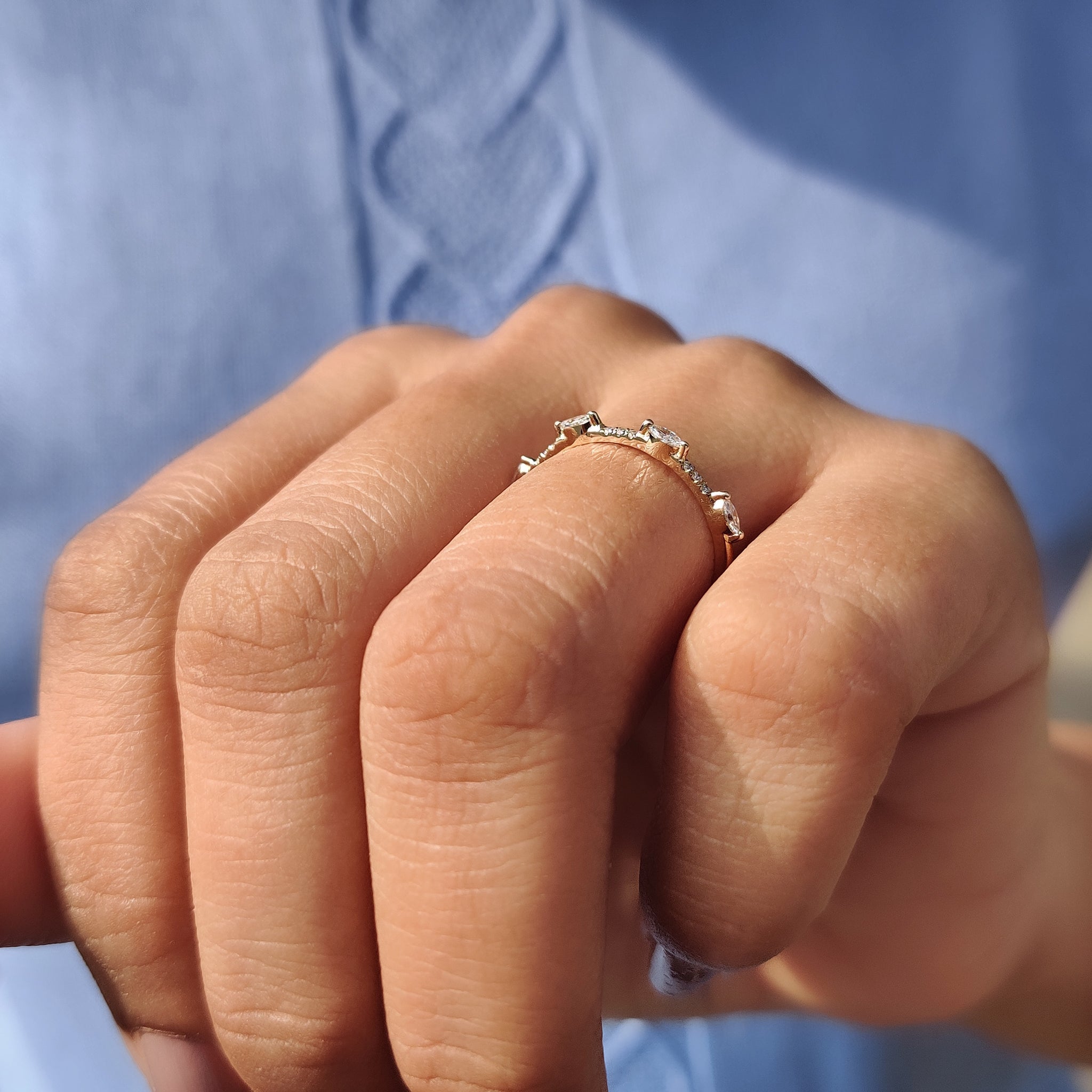 Prong set wedding band showcasing brilliant diamonds.
