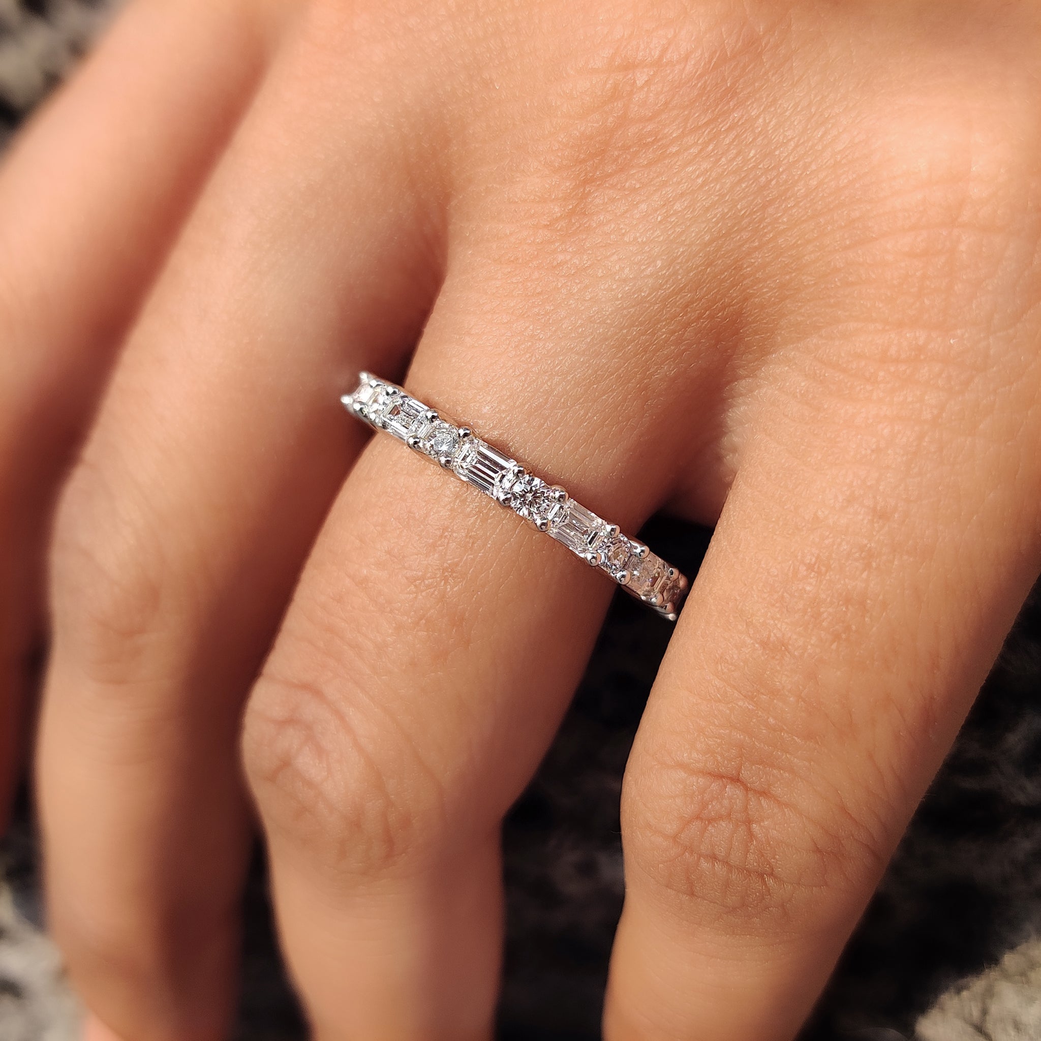 White gold diamond band with a classic prong setting.