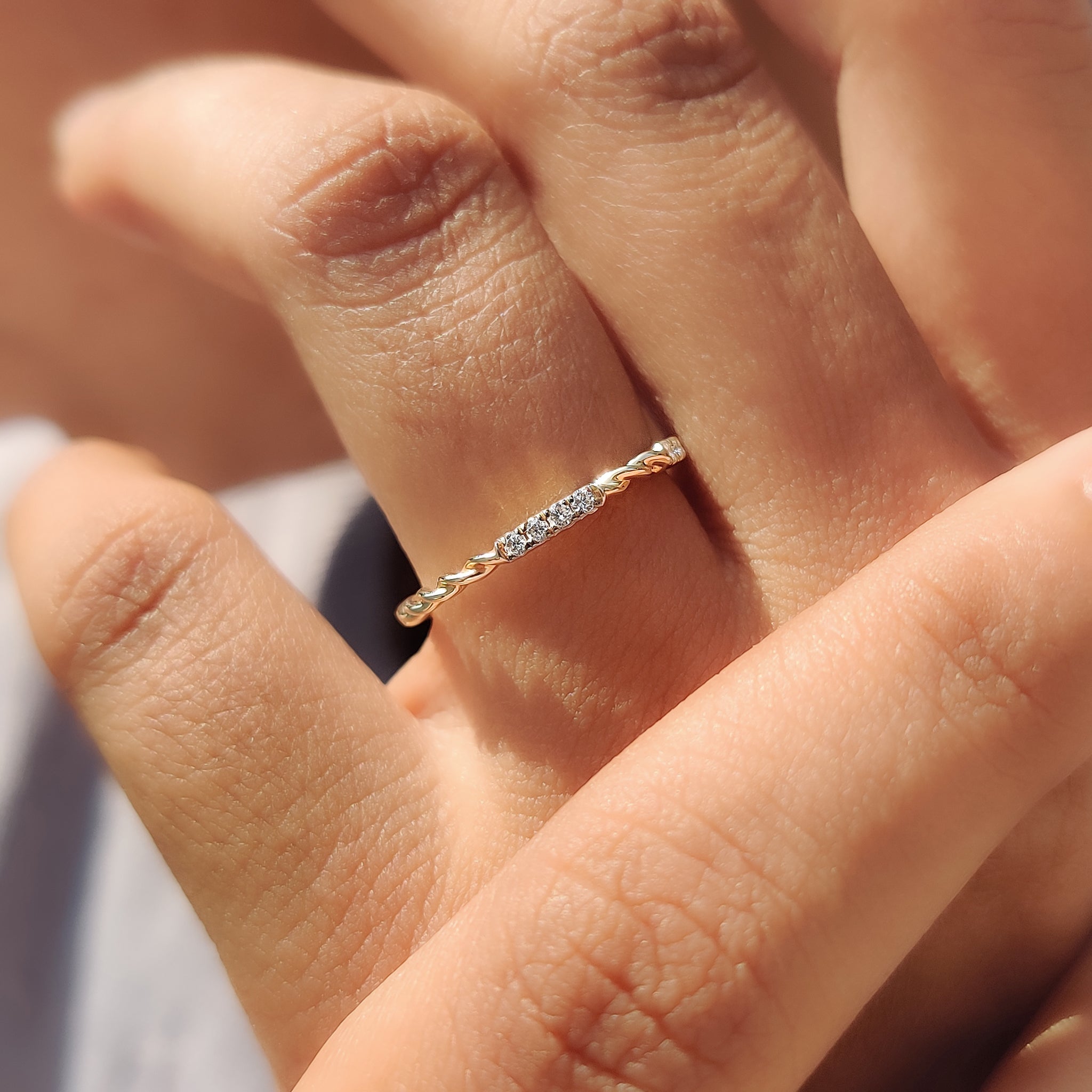Elegant handmade wedding band with lab-grown stones.