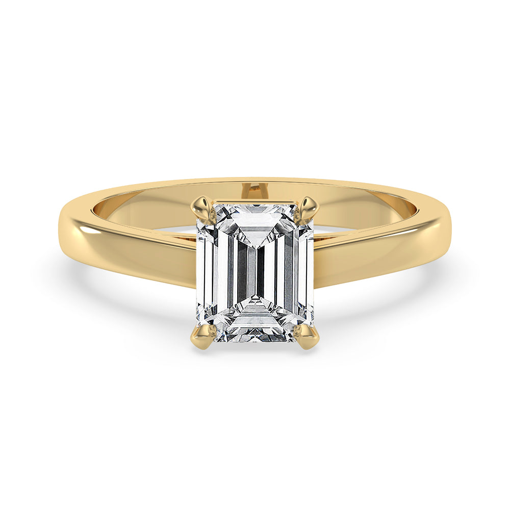 Two carat emerald cut diamond ring in a classic basket setting, perfect for a timeless look.

