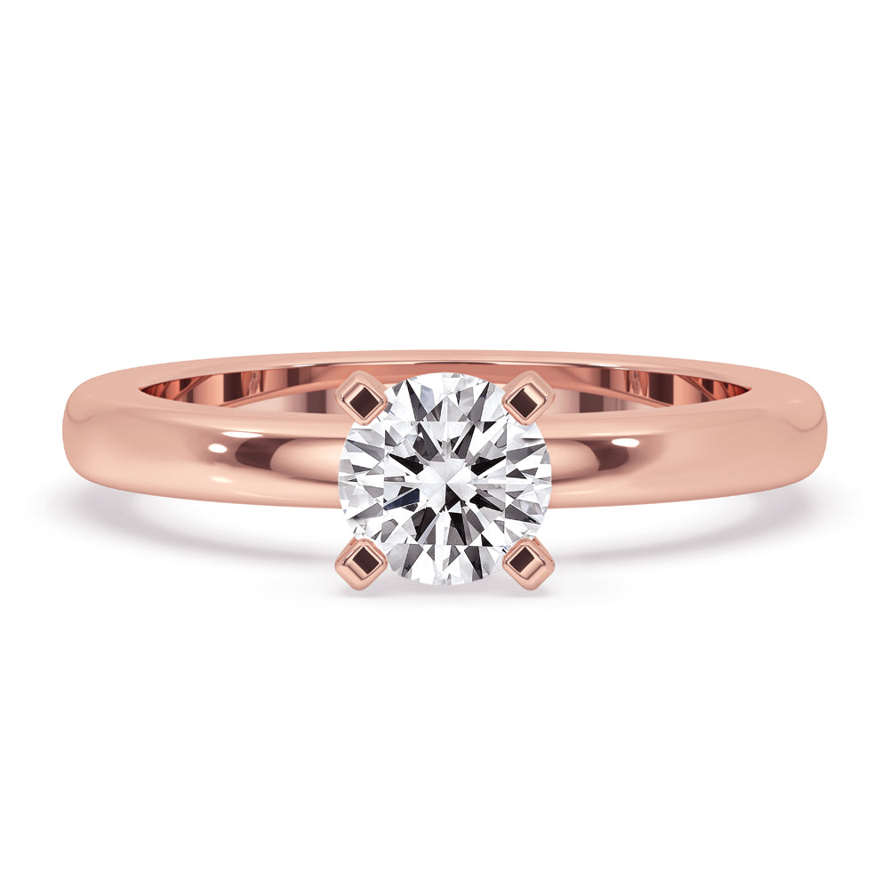 Round solitaire diamond ring with a four prong solitaire setting and lab grown diamond.