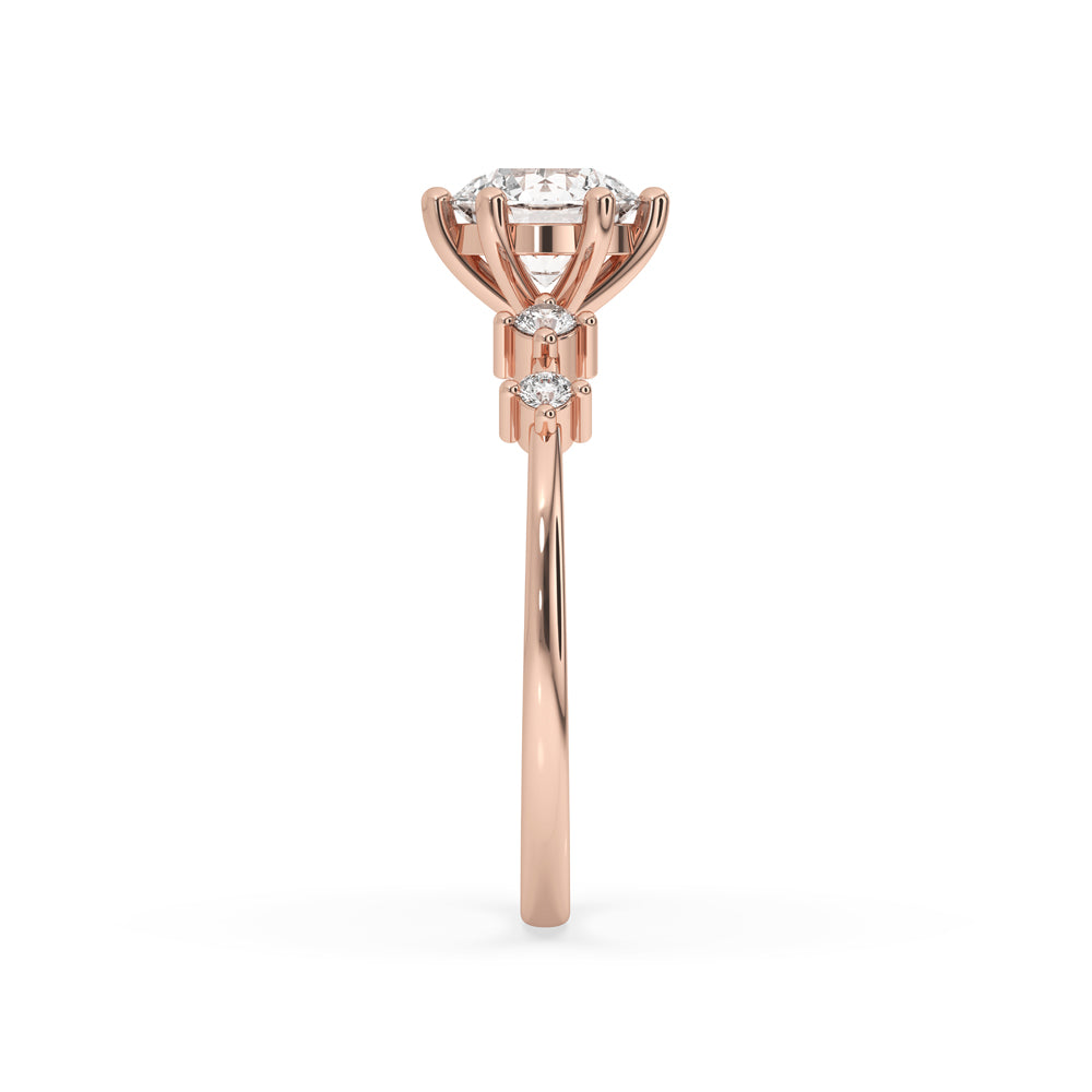 Engagement ring with side stones in a round prong setting, crafted with Lab Grown Diamond and handmade ring quality.