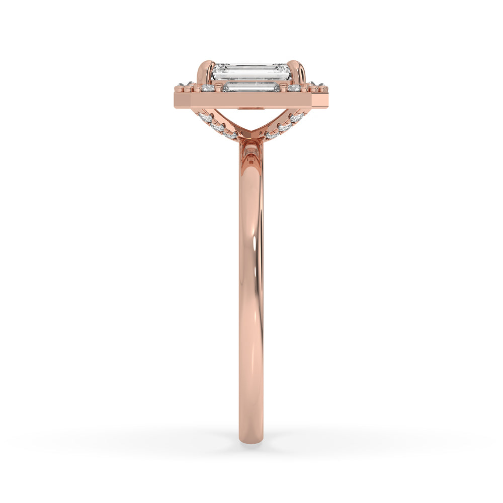 Handmade emerald cut diamond engagement ring with claw prong setting and vintage-inspired design.
