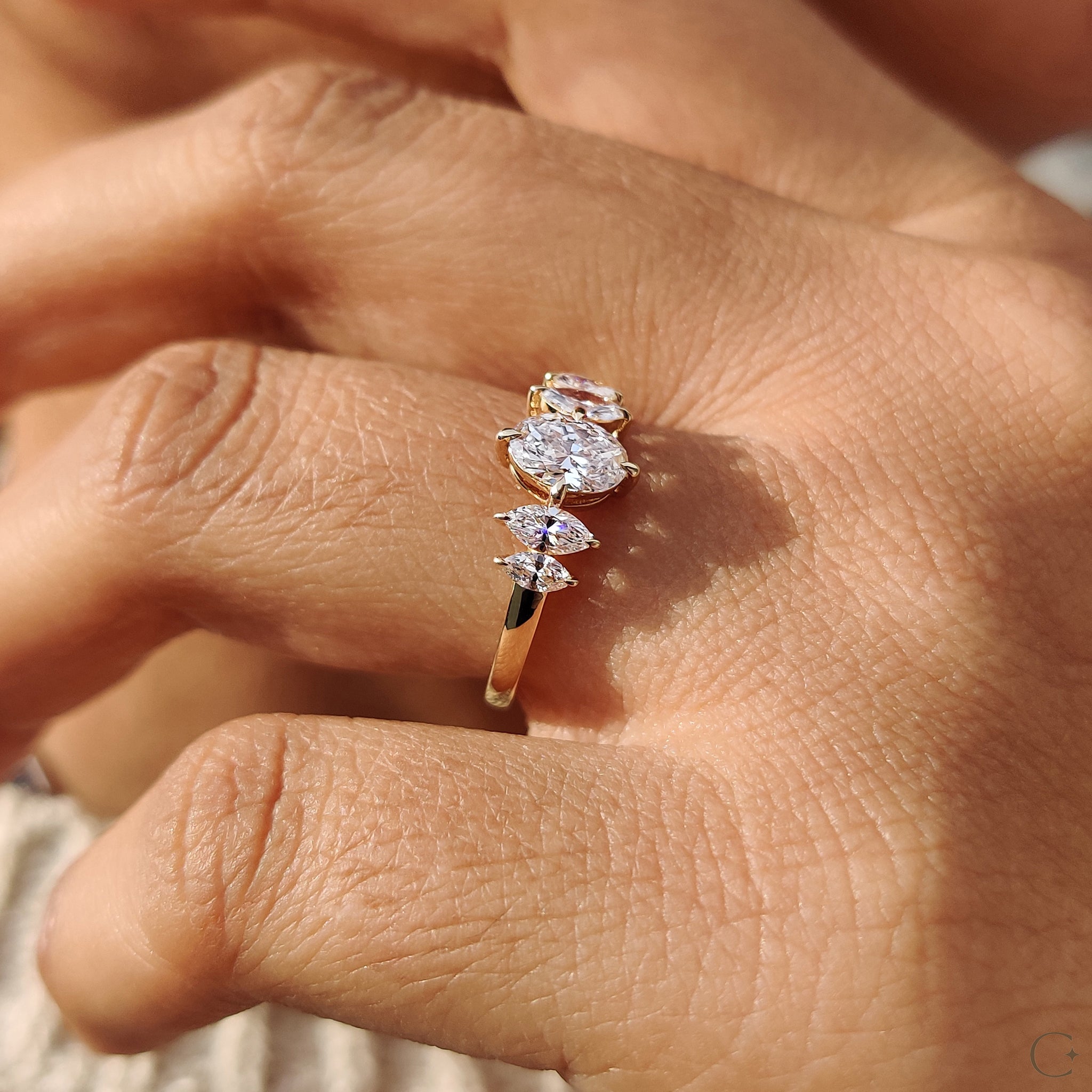 Lab grown diamond ring with an oval centerpiece.
