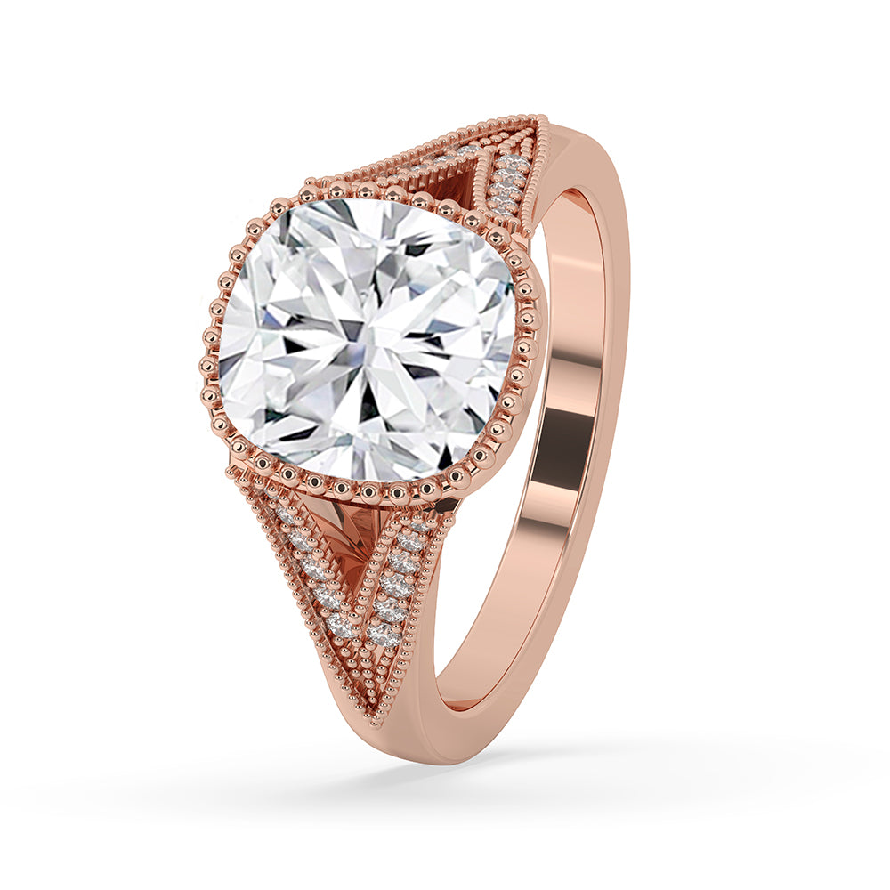 Bezel set engagement ring featuring a cushion cut diamond.
