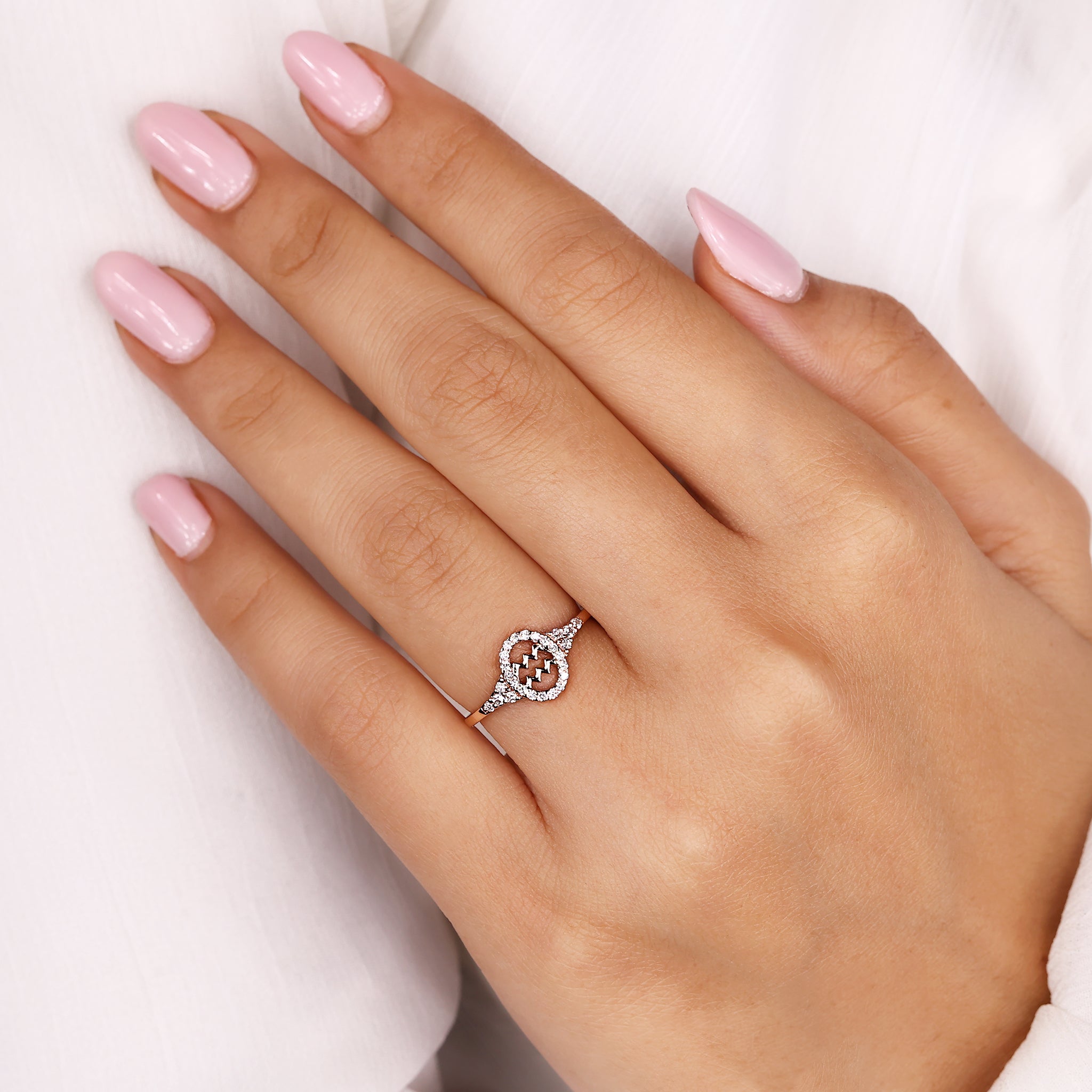 Aquarius horoscope ring in rose gold with Lab Grown Diamond center.
